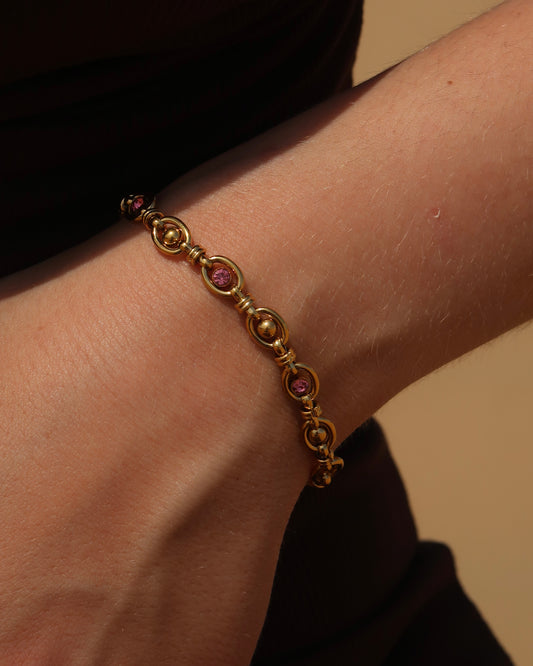 Gouden statement armband met roze steentjes van stainless steel