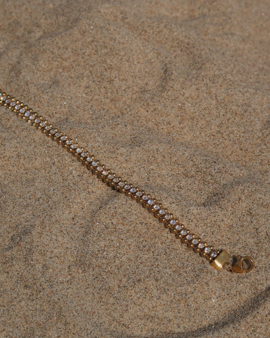 Goudkleurige armband met zilveren steentjes en verstelbare sluiting – stainless steel