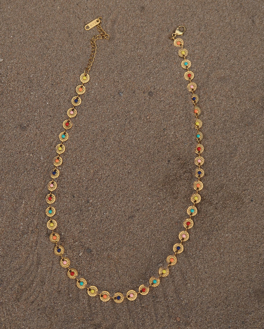 Gouden statement ketting met rondjes en gekleurde bloemdetails