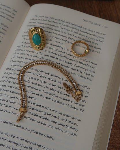 Goudkleurige armband met zilveren steentjes en verstelbare sluiting – stainless steel