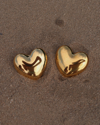 Goude hartvormige statement oorbellen stainless steel