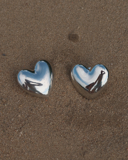 zilverkleurige stainless steel hartvormige statement oorbellen