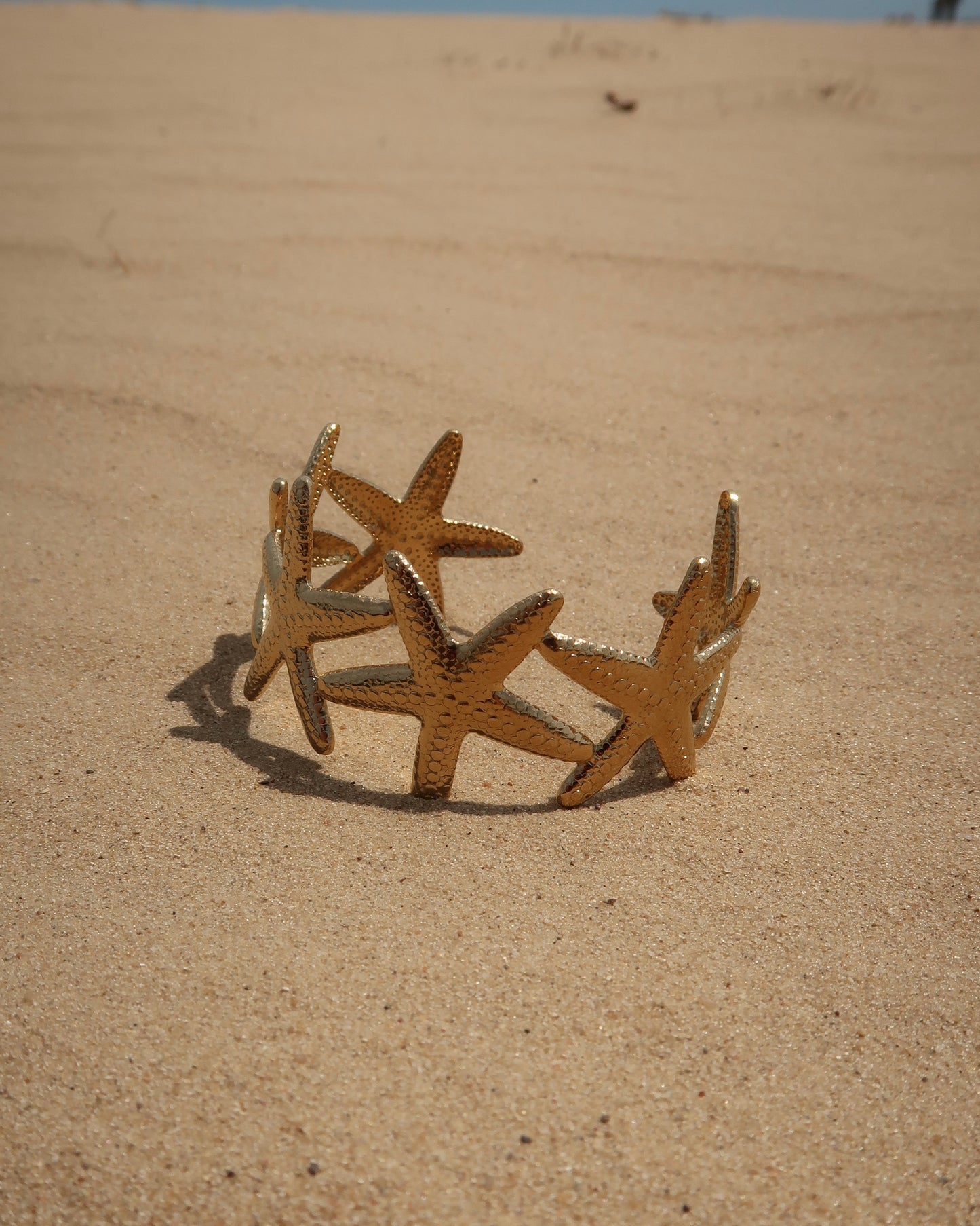 Goude verstelbare armband van zeesterren - stainless steel 