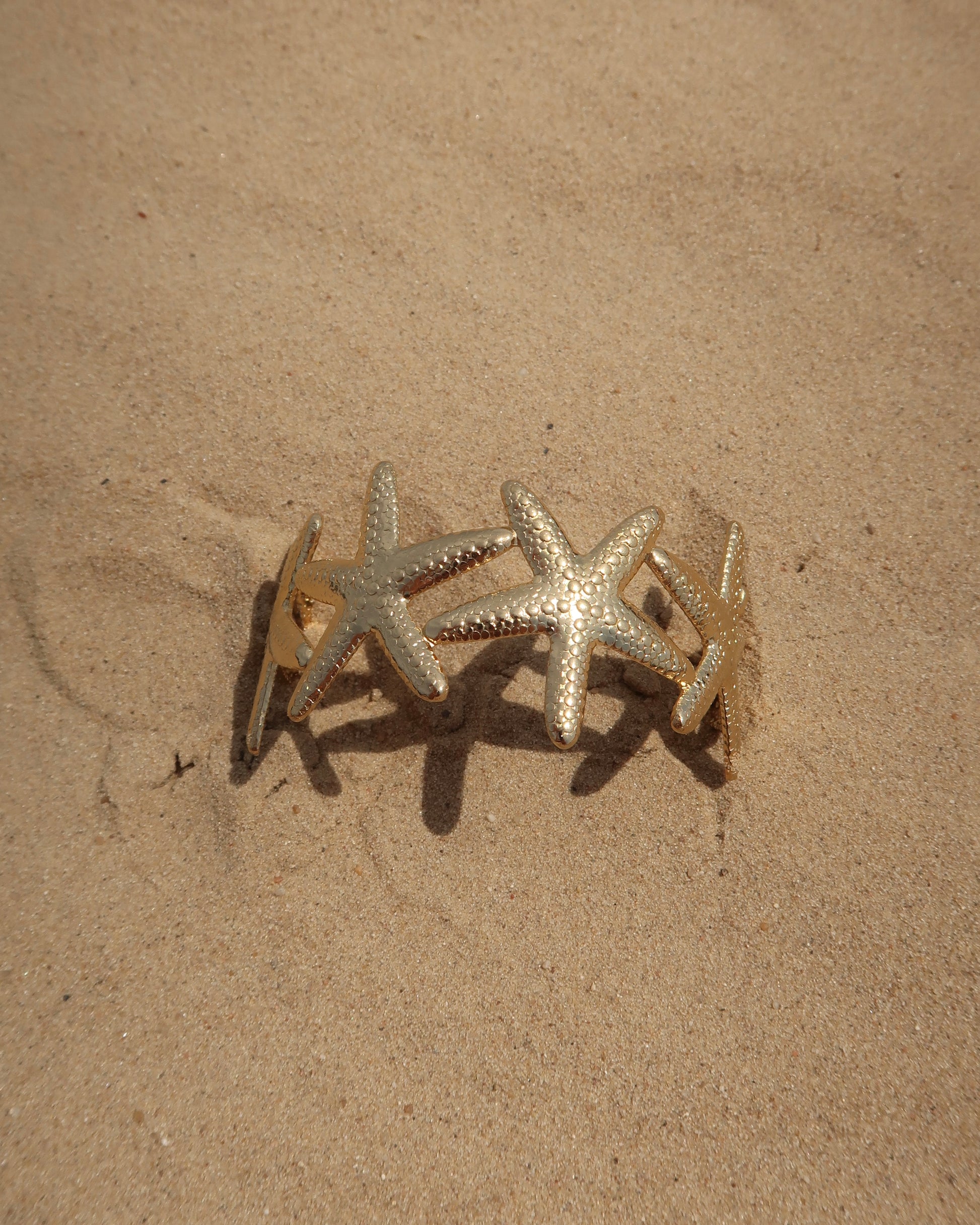 Goude verstelbare armband van zeesterren - stainless steel 