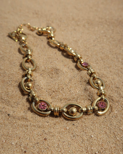 Gouden statement armband met roze steentjes van stainless steel 