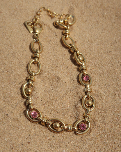 Gouden statement armband met roze steentjes van stainless steel 