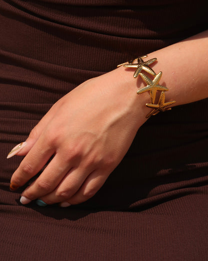 Goude verstelbare armband van zeesterren - stainless steel 