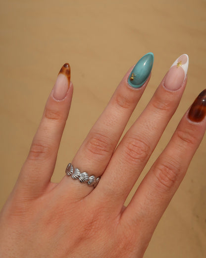 Bali Ring: verstelbare gouden of zilveren ring met schelpdetails. Stainless steel en waterproof.