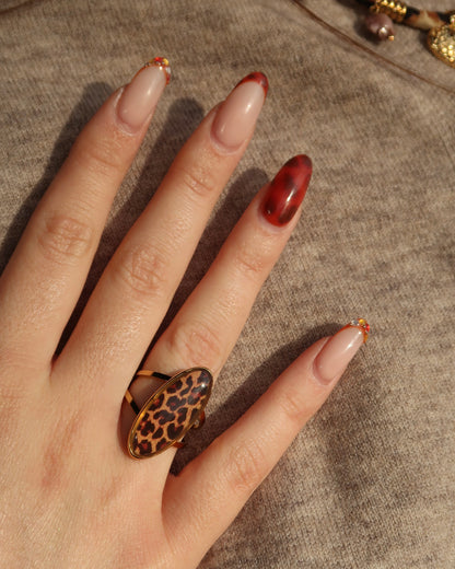 Gouden ring met ovale panterprint steen, verstelbaar, stainless steel en waterproof.